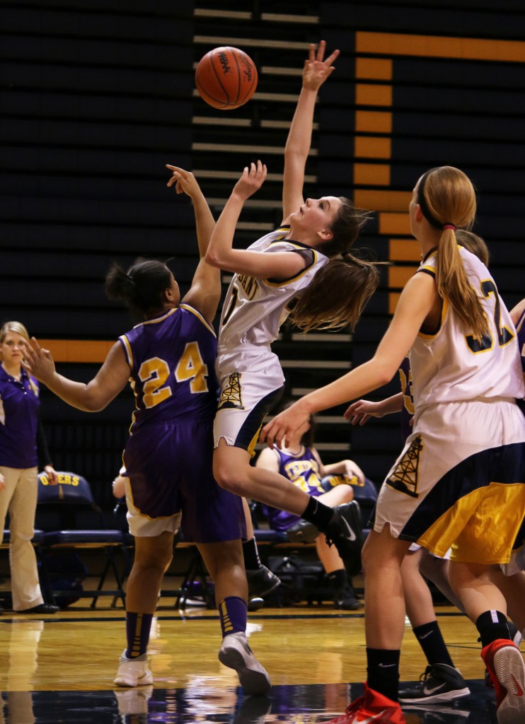 Bay City Central's Jonae Evans, (24), blocks the shot of Mount Pleasant High School's Victoria Arends, (30), at the freshman basketball game at Mount Pleasant Highschool,  1155 S. Elizabeth St., Mount Pleasant, Michigan, Thursday, February 5, 2015. Bay City Central beat Mount Pleasant High School 24-22.  