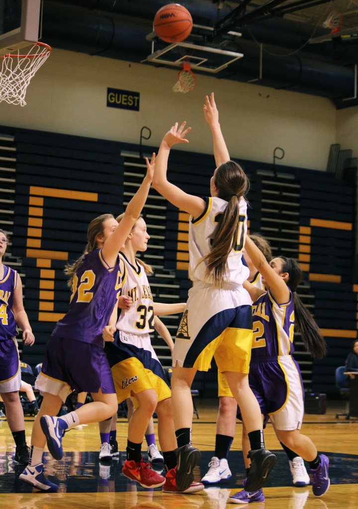 Mount Pleasant High School's Victoria Arends, (30), shoots the ball over  Bay City Central's Maylen Herman, (32), at the freshman basketball game at Mount Pleasant Highschool,  1155 S. Elizabeth St., Mount Pleasant, Michigan, Thursday, February 5, 2015. Bay City Central beat Mount Pleasant High School 24-22.  