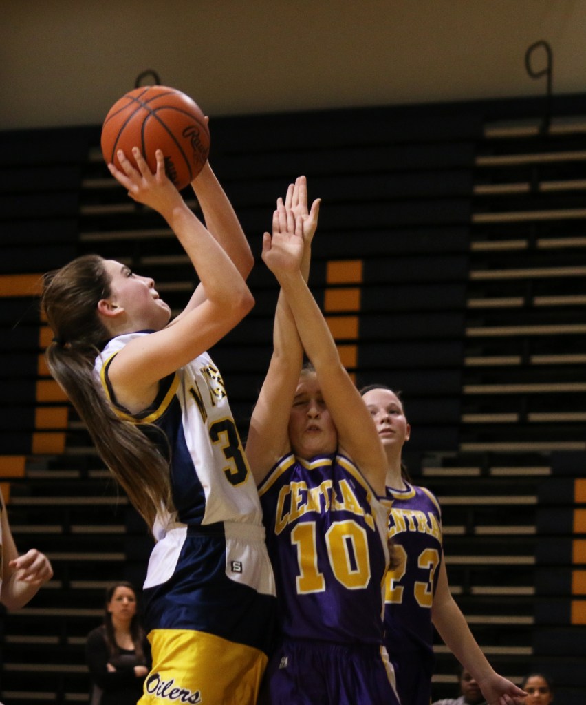 Mount Pleasant High School's Victoria Arends, (30), shoots the ball over  Bay City Central's Emily Anthony, (10), at the freshman basketball game at Mount Pleasant Highschool,  1155 S. Elizabeth St., Mount Pleasant, Michigan, Thursday, February 5, 2015. Bay City Central beat Mount Pleasant High School 24-22.  