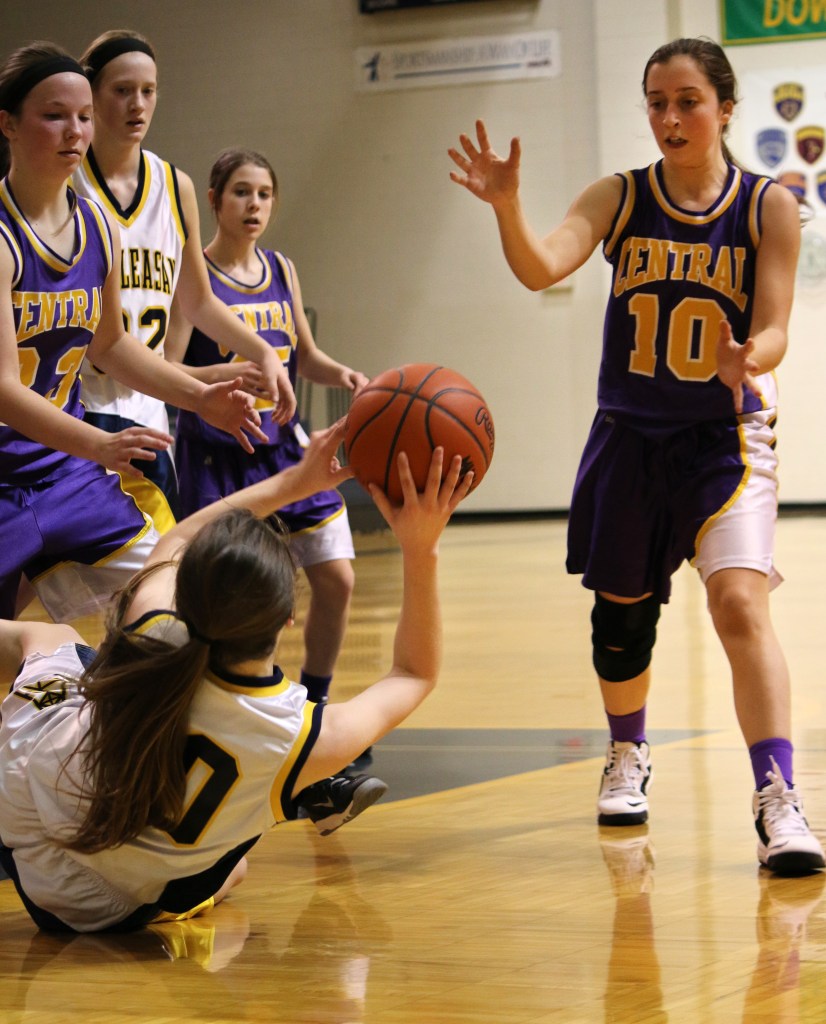 Mount Pleasant High School's Victoria Arends, (30), looks for an open pass as  Bay City Central's Emily Anthony, (10), blocks at the freshman basketball game at Mount Pleasant Highschool,  1155 S. Elizabeth St., Mount Pleasant, Michigan, Thursday, February 5, 2015. Bay City Central beat Mount Pleasant High School 24-22.  