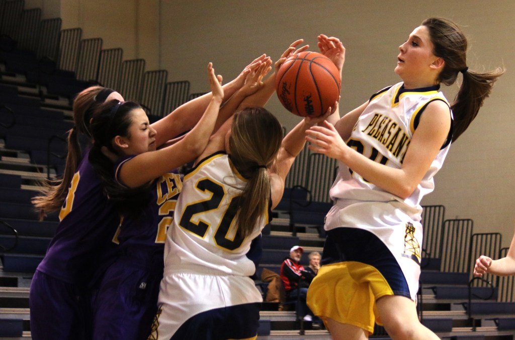 Mount Pleasant High School's Victoria Arends, (30), Lauren Lybeer, (20), and Bay City Central's Larisa Narvaiz, (22), and Brenna Legner (23) jump for the ball at the freshman basketball game at Mount Pleasant Highschool,  1155 S. Elizabeth St., Mount Pleasant, Michigan, Thursday, February 5, 2015. Bay City Central beat Mount Pleasant High School 24-22.  