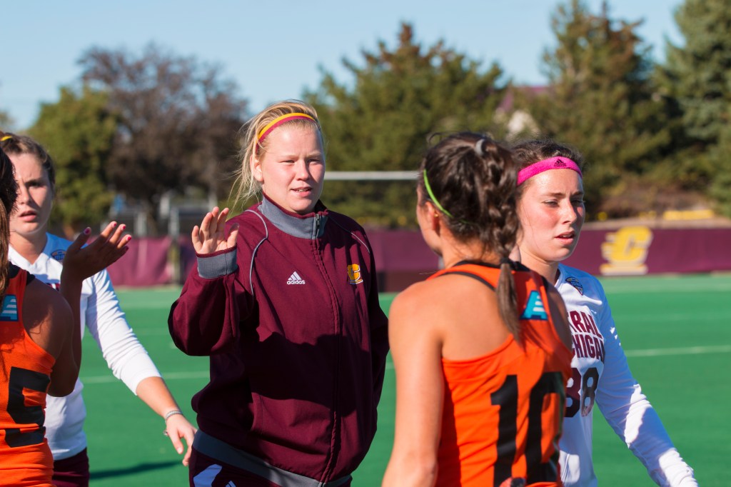 Maude Stalars high fives the players of the Pacific Tigers after a 2-1 loss at the Central Michigan Field Hockey Stadium on Thursday, Oct. 1, 2015. The CMU field hockey team has lost 12 straight games this season. 